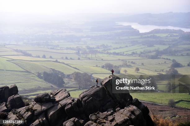 People are seen enjoying their daily exercise as they walk at the Roaches in the Peak District on November 06, 2020 in Leek, Staffordshire .