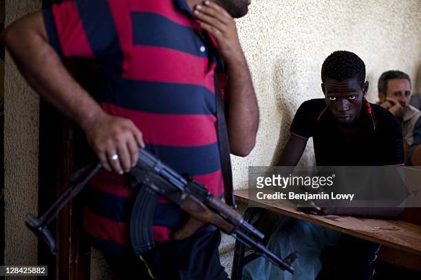 Approximately 150 suspected Gaddafi loyalist soldiers are held captive in an elementary school on August 28 2011 in Tripoli, Libya.
