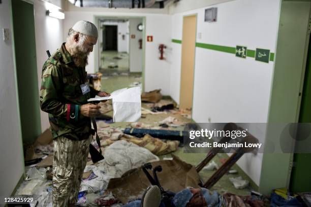 Libyan rebels tour the massive underground hospital complex that streches across the compound belonging to Al-Mu'tasim-Billah al-Gaddafi, a son of...