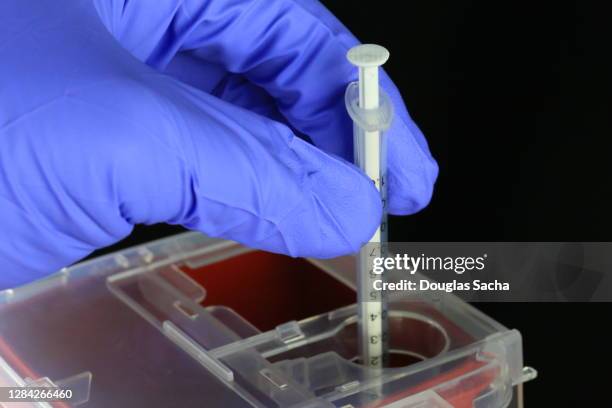 sharps container for biohazard hypodermic needles - biogefährliche substanz stock-fotos und bilder