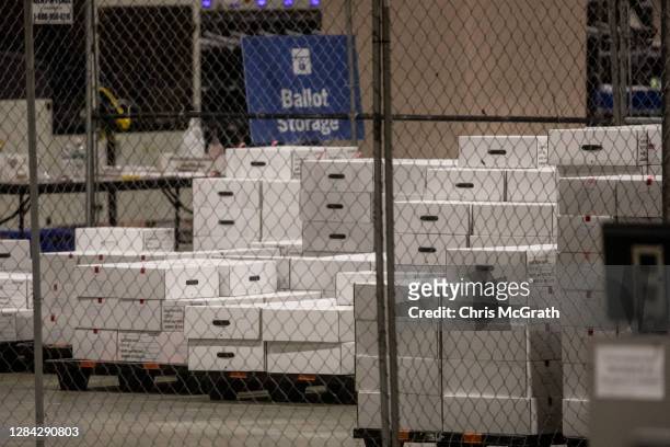 Boxes of counted ballots are seen locked in the ballot storage area at the Philadelphia Convention Center on November 06, 2020 in Philadelphia,...