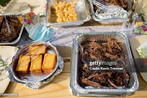 outdoor table full of barbecue food in trays - corn bread stock pictures, royalty-free photos & images