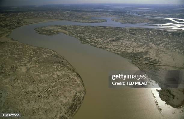 aerial view of flood waters on warburton river mouth, lake eyre, sa - lake eyre stock pictures, royalty-free photos & images