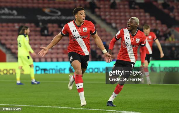 Southampton player Che Adams celebrates his opening goal with Moussa Djenepo during the Premier League match between Southampton and Newcastle United...