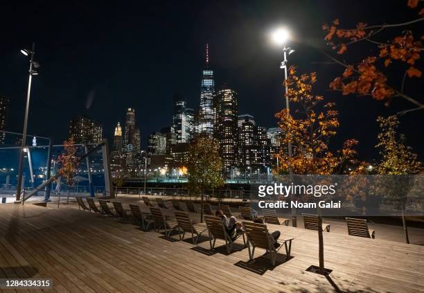 People sit at Pier 26 at Hudson River Park as the city continues the re-opening efforts following restrictions imposed to slow the spread of...