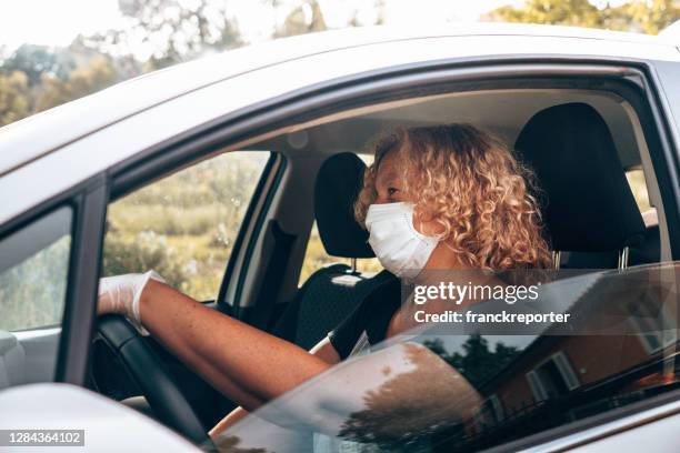 woman stopped by the police to do a control - coronavirus punishment stock pictures, royalty-free photos & images