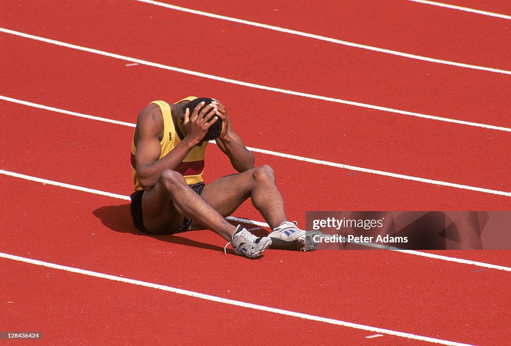 Sad sprinter sitting