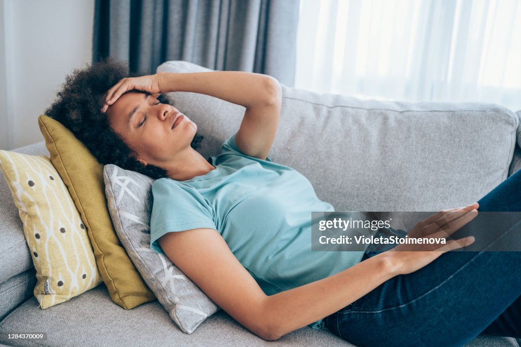 Woman with high fever at home.