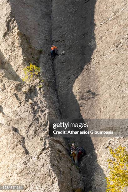 Rock climbers on October 27, 2020 in Meteora, Greece. Meteora, a UNESCO World Heritage Site since 1989 is a popular tourist attraction for people all...