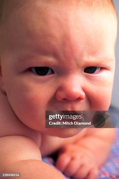 portrait of angry baby - funny baby faces stock pictures, royalty-free photos & images