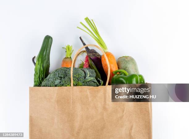 healthy food background. healthy vegan vegetarian food in paper bag - paper bag stock-fotos und bilder