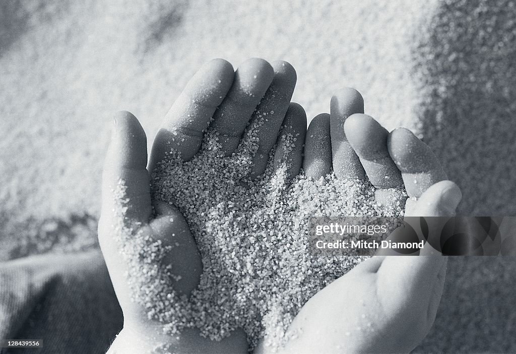 Hands w/ sand grains