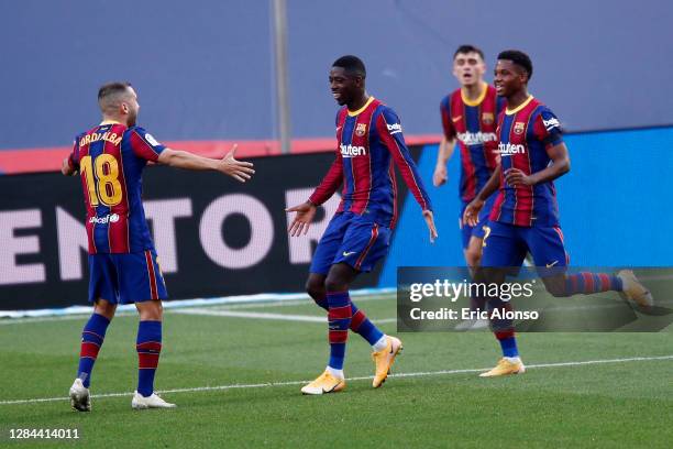 Ousmane Dembele of FC Barcelona celebrates with teammates after scoring his team's first goal during the La Liga Santander match between FC Barcelona...