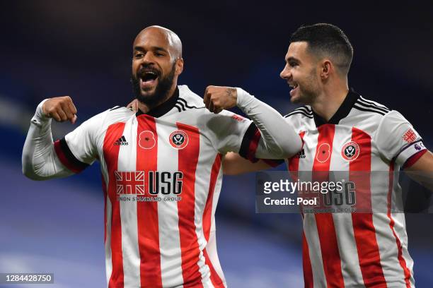 David McGoldrick of Sheffield United celebrates with teammate John Egan after scoring his team's first goal during the Premier League match between...