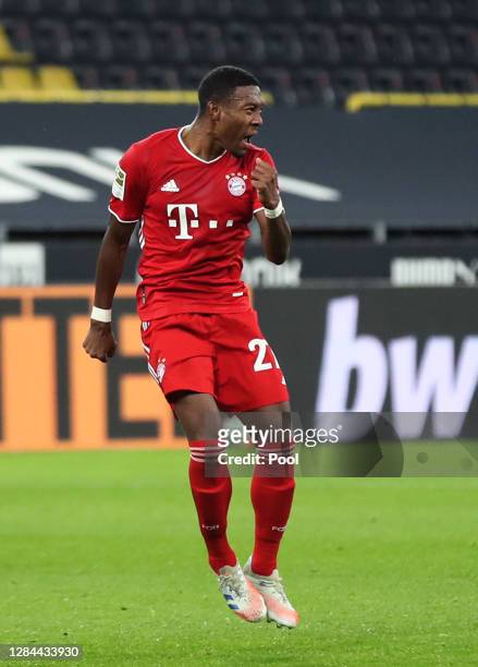 David Alaba of Muenchen celebrates his team's first goal during the Bundesliga match between Borussia Dortmund and FC Bayern Muenchen at Signal Iduna...