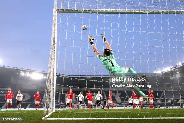 Jack Walton of Barnsley makes a save during the Sky Bet Championship match between Derby County and Barnsley at Pride Park Stadium on November 07,...