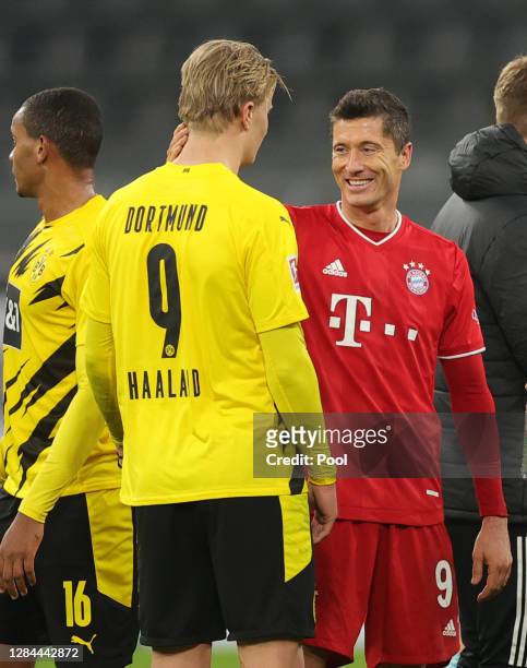 Erling Haaland of Dortmund and Robert Lewandowski of Muenchen chat after the Bundesliga match between Borussia Dortmund and FC Bayern Muenchen at...