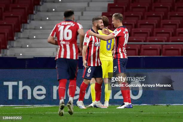 Marcos Llorente of Atletico de Madrid celebrates with teammate Koke after scoring his team's second goal during the La Liga Santander match between...
