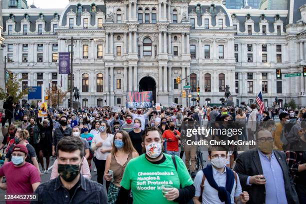 People celebrate outside Philadelphia City Hall after Joe Biden was declared winner of the 2020 presidential election on November 07, 2020 in...