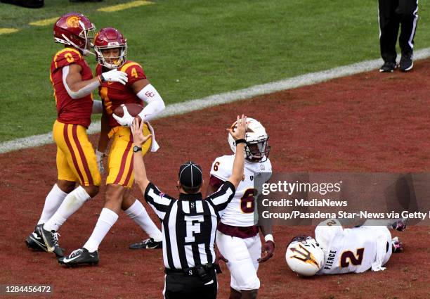 Wide receiver Bru McCoy of the USC Trojans catches a pass for a touchdown that was tipped by teammate wide receiver Amon-Ra St. Brown has he was...