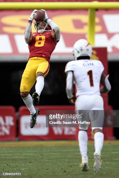 Amon-Ra St. Brown of the USC Trojans catches a pass during the second half of a game against the Arizona State Sun Devils at Los Angeles Coliseum on...