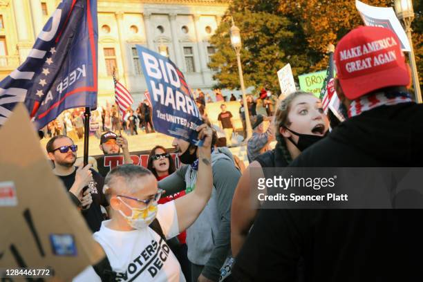 Hundreds of people for and against Donald Trump gather in the state capital of Pennsylvania to display their anger at the outcome of the election...