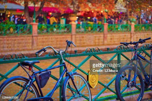 parked bicycles at eskisehir porsuk river side - eskisehir stock pictures, royalty-free photos & images