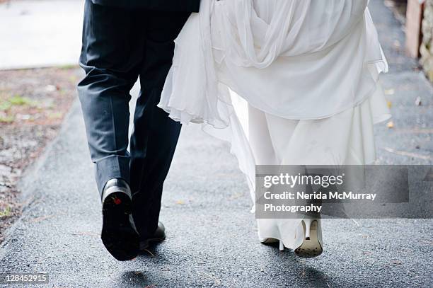 bride & grooms feet - wedding feet stock-fotos und bilder