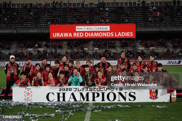 Players of Urawa Red Diamonds Ladies celebrate with the trophy after the Nadeshiko League match between Urawa Red Diamonds Ladies and Ehime FC Ladies...