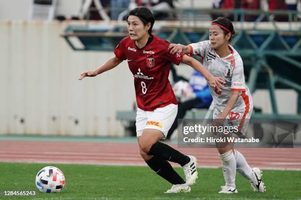 Sonoka Matsumoto of Ehime FC Ladies and Hikaru Naomoto of Urawa Red Diamonds compete for the ball during the Nadeshiko League match between Urawa Red...
