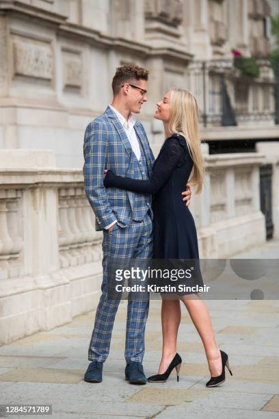 Influencer and model Angus Findlay wears a Marc Darcy suit, and waistcoat, Ralph Lauren shirt, Lasocki shoes and Dior glasses with model and...