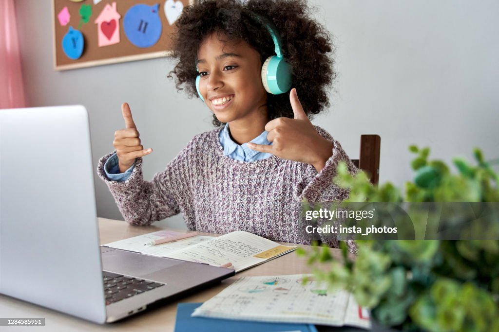 Smiling Deaf African girl on a virtual therapy session