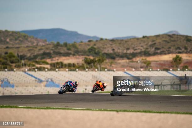 Joan Mir of Spain and Team SUZUKI ECSTAR leads in front of Alex Rins of Spain and Team SUZUKI ECSTAR and Pol Espargaro of Spain and Red Bull KTM...