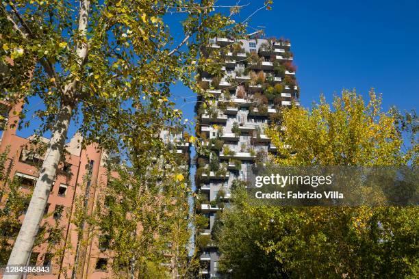 The lush and colourful vegetation of the "Biblioteca degli Alberi" park in front of the "Bosco Verticale" the skyscraper designed by architect...