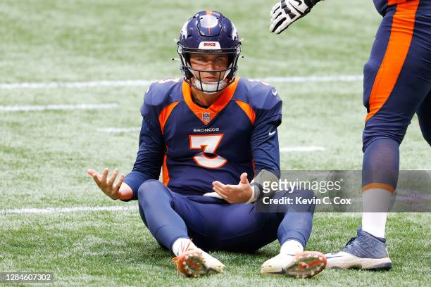 Drew Lock of the Denver Broncos reacts on the ground during the second half against the Atlanta Falcons at Mercedes-Benz Stadium on November 08, 2020...