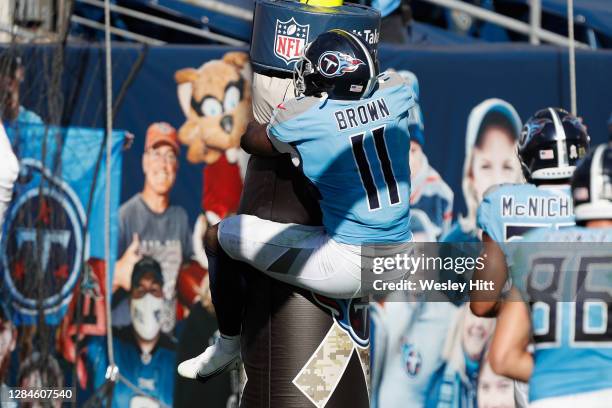 Brown of the Tennessee Titans hugs the goal post after a first half touchdown against the Chicago Bears at Nissan Stadium on November 08, 2020 in...