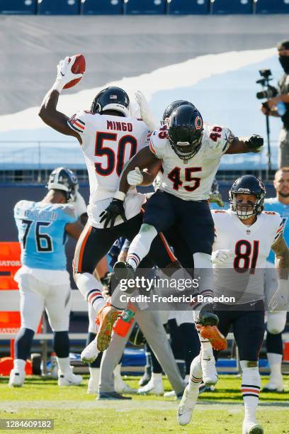 Barkevious Mingo and Joel Iyiegbuniwe of the Chicago Bears celebrate recovering the ball during a fake punt in the second quarter against the...