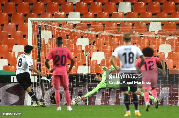 Carlos Soler of Valencia scores his team's first goal from the penalty spot during the La Liga Santander match between Valencia CF and Real Madrid at...