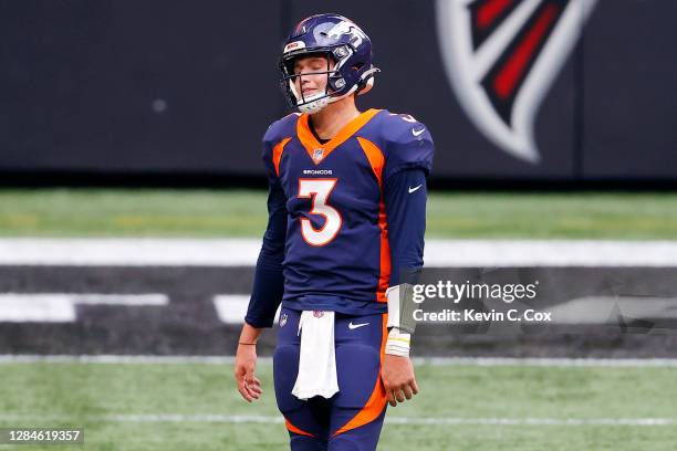 Drew Lock of the Denver Broncos reacts after an illegal shift penalty during the fourth quarter of the game against the Atlanta Falcons at...