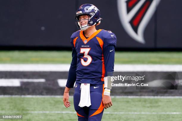 Drew Lock of the Denver Broncos reacts after an illegal shift penalty during the fourth quarter of the game against the Atlanta Falcons at...