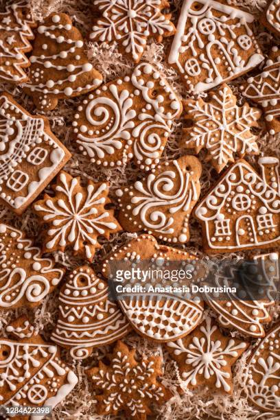 christmas gingerbread cookies on holiday packaging. homemade cookies. - mitten stock pictures, royalty-free photos & images