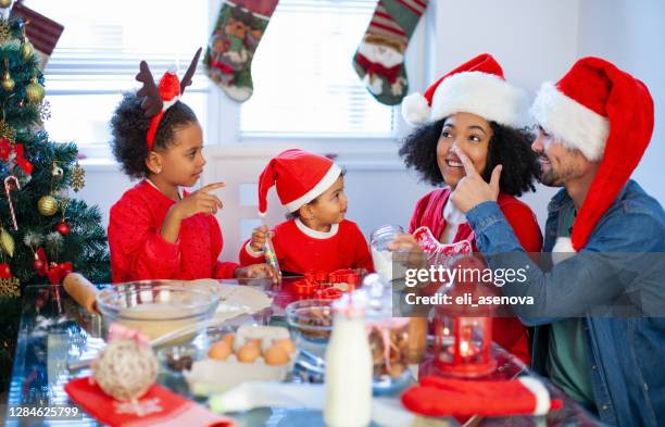 let's make cookies for christmas - kids cooking christmas stock pictures, royalty-free photos & images