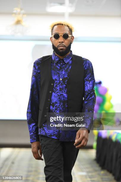 Model walks the runway during the Fashion Nova and City Trends fashion show at the FTM Fashion Week at the Holiday Inn Fredericksburg Conference Ctr...
