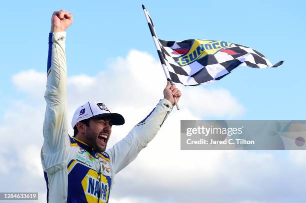 Chase Elliott, driver of the NAPA Auto Parts Chevrolet, celebrates in victory lane after winning the NASCAR Cup Series Season Finale 500 and the 2020...