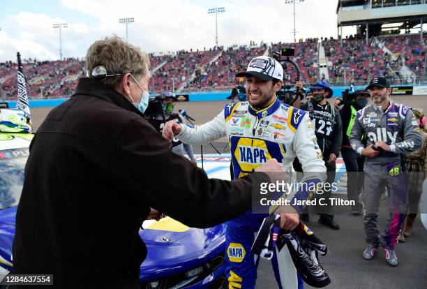 Chase Elliott, driver of the NAPA Auto Parts Chevrolet, celebrates with his father, NASCAR Hall of Famer Bill Elliott after winning the NASCAR Cup...