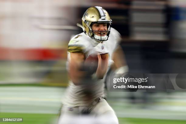 Taysom Hill of the New Orleans Saints runs with the ball during the first half against the Tampa Bay Buccaneers at Raymond James Stadium on November...