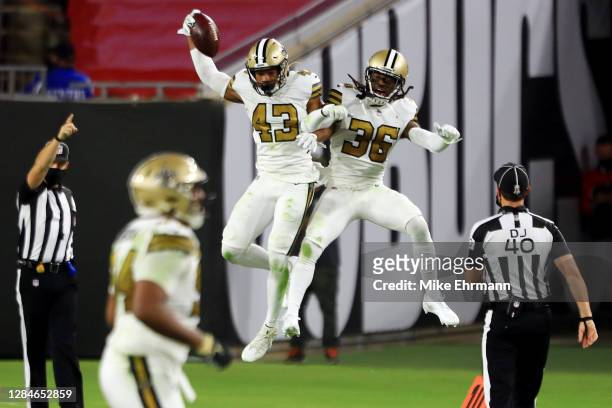 Marcus Williams of the New Orleans Saints celebrates with D.J. Swearinger after intercepting a pass during the second quarter against the Tampa Bay...