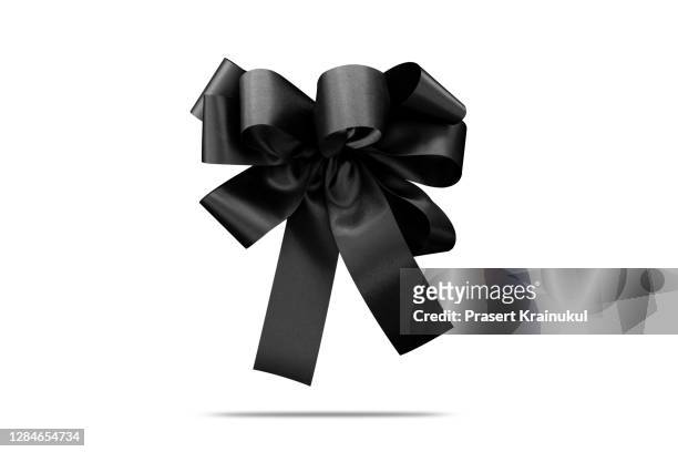 style black silk ribbon bow isolated on the white background - mourning bildbanksfoton och bilder