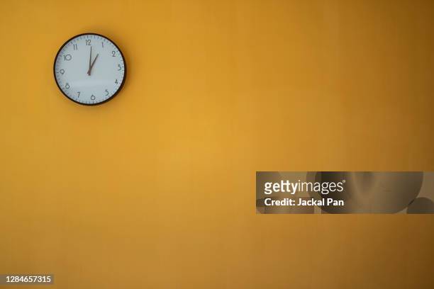 the concept of time - clock on wall stock pictures, royalty-free photos & images