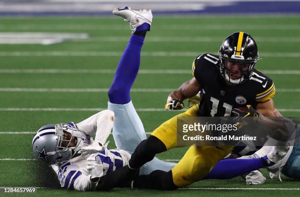 Chase Claypool of the Pittsburgh Steelers runs the ball past Trevon Diggs of the Dallas Cowboys in the fourth quarter at AT&T Stadium on November 08,...